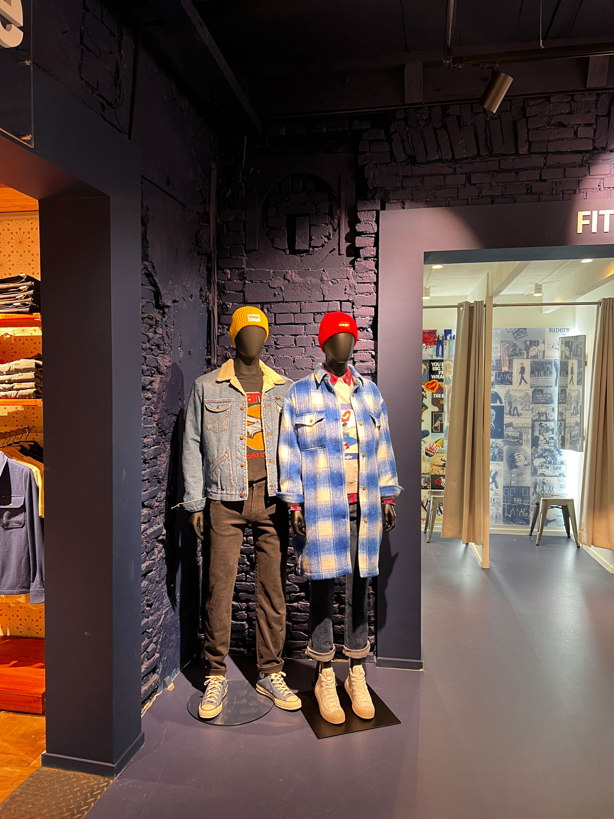 Wrangler and Lee fit area with mannequins against a brick wall