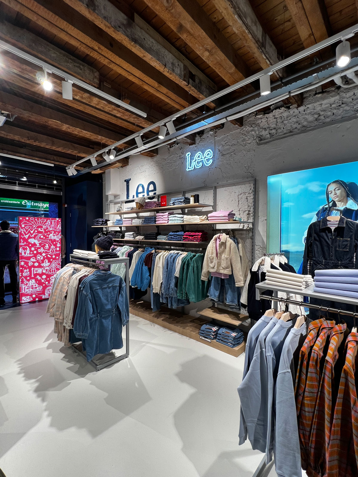 Lee store interior with timber ceiling and track lighting