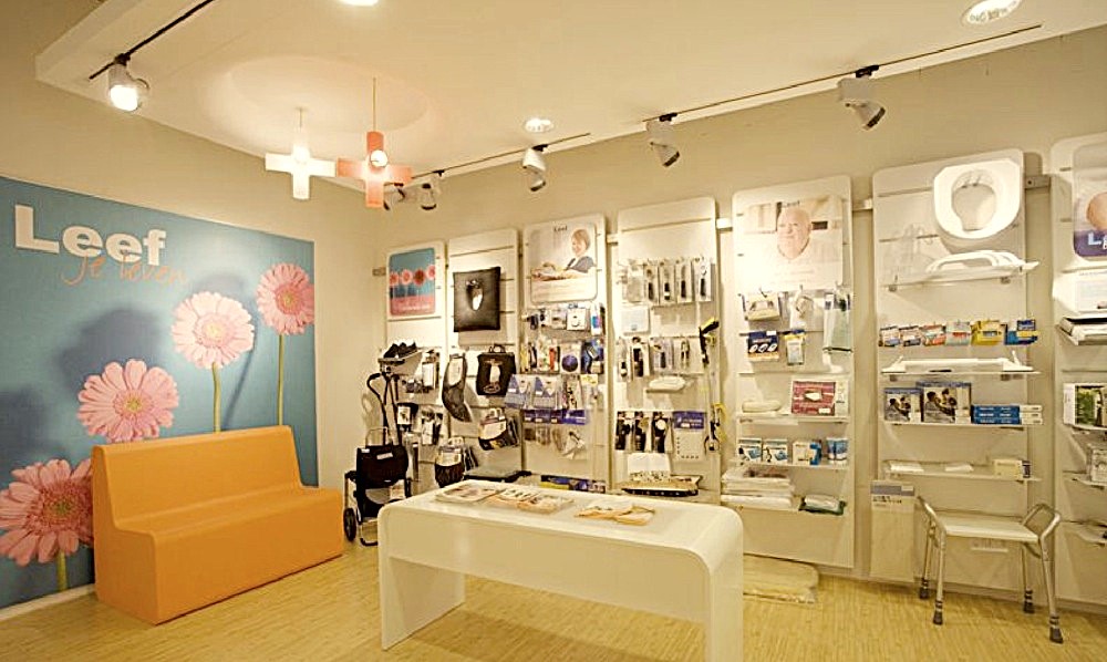 Leef health store with orange sofa and product walls