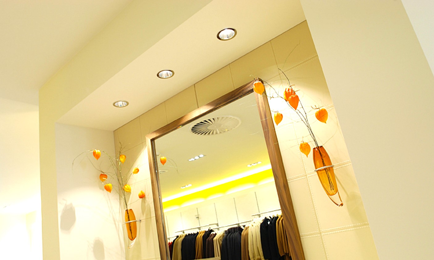Peeters fashion store fitting room area with warm lighting