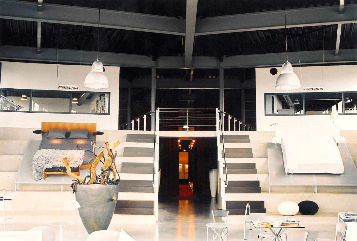 Zeth showroom with mezzanine, staircase and furniture settings